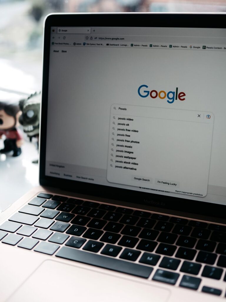 A laptop screen displaying an AI browser agent completing a web search task