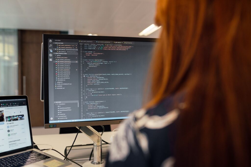 Software engineer writing code, representing rising AI coding agent adoption among developers